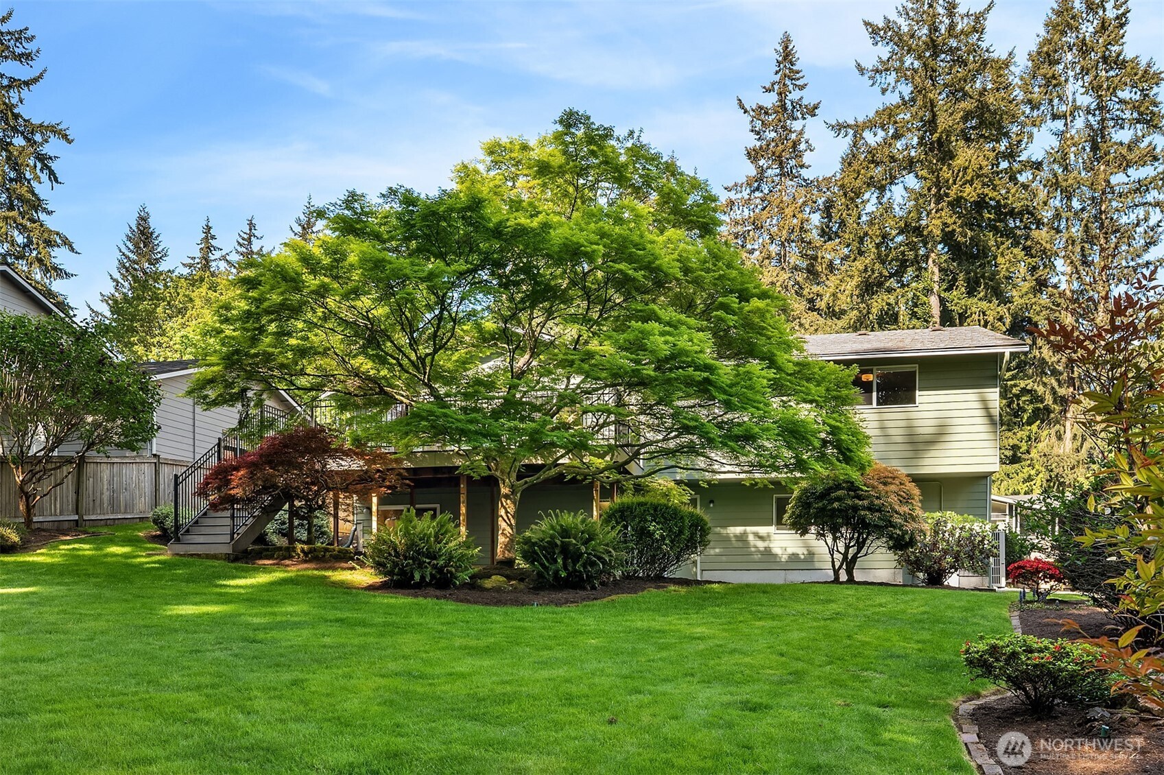 21331 2nd Avenue Southeast Bothell, WA 98021 - Photo 31 of 34 a front view of a house with a garden
