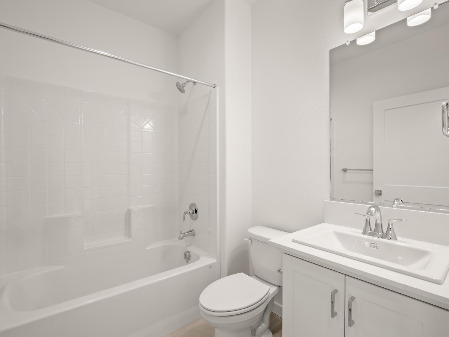 781 Elizabeth Avenue Madera, CA 93636 - Photo 11 of 31 a bathroom with a sink toilet and shower