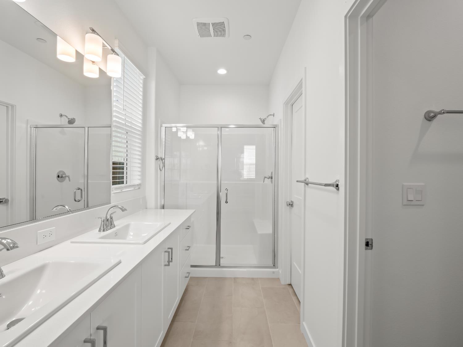 781 Elizabeth Avenue Madera, CA 93636 - Photo 15 of 31 a spacious bathroom with a double vanity sink mirror and shower