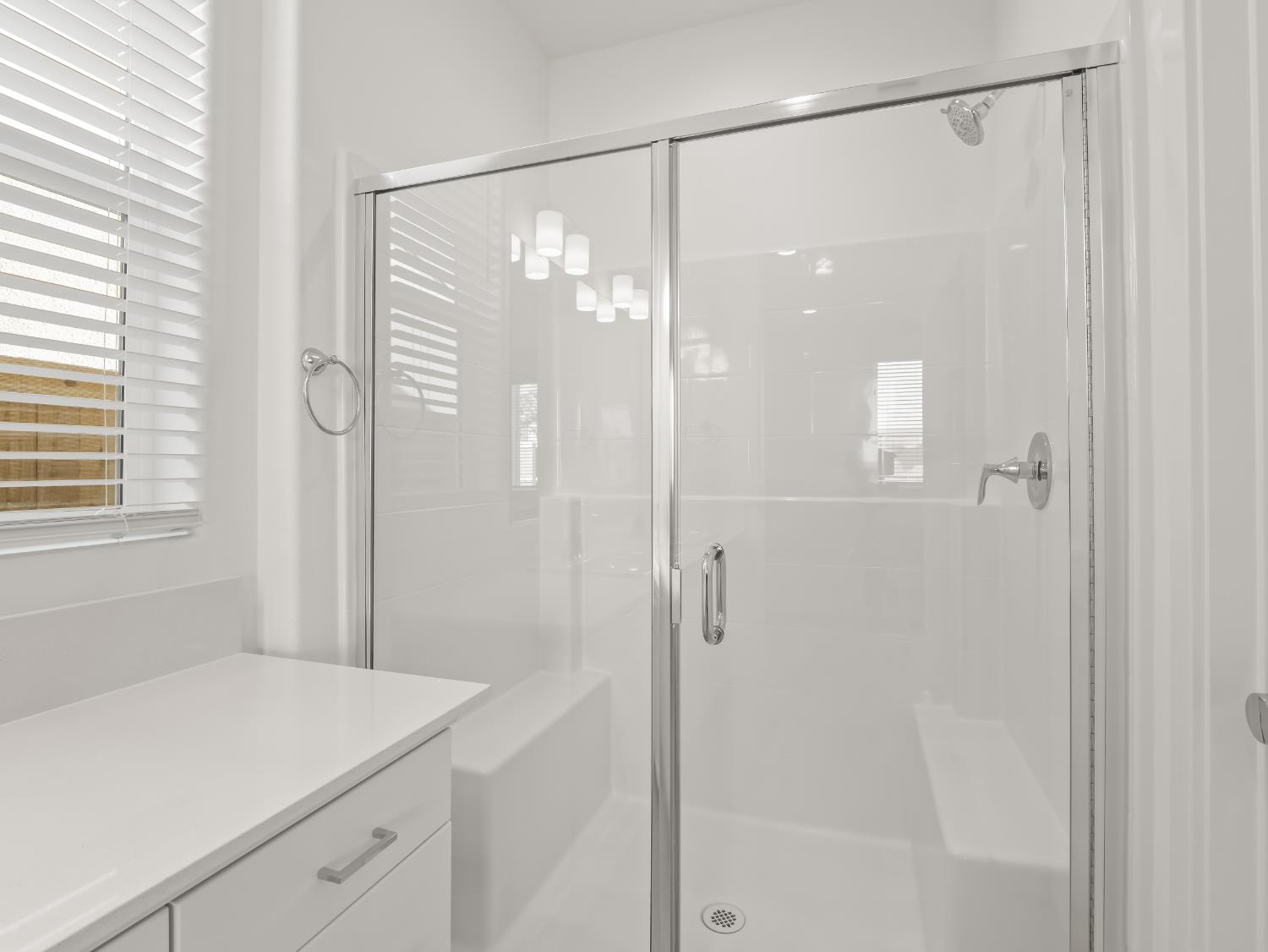 781 Elizabeth Avenue Madera, CA 93636 - Photo 17 of 31 a bathroom with a shower and a sink a mirror