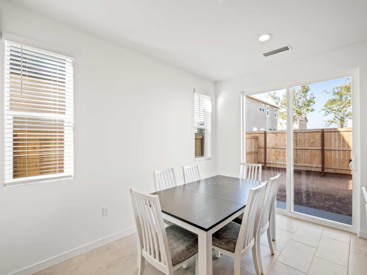 781 Elizabeth Avenue Madera, CA 93636 - Photo 21 of 31 a view of a dining room with furniture wooden floor and a carpet