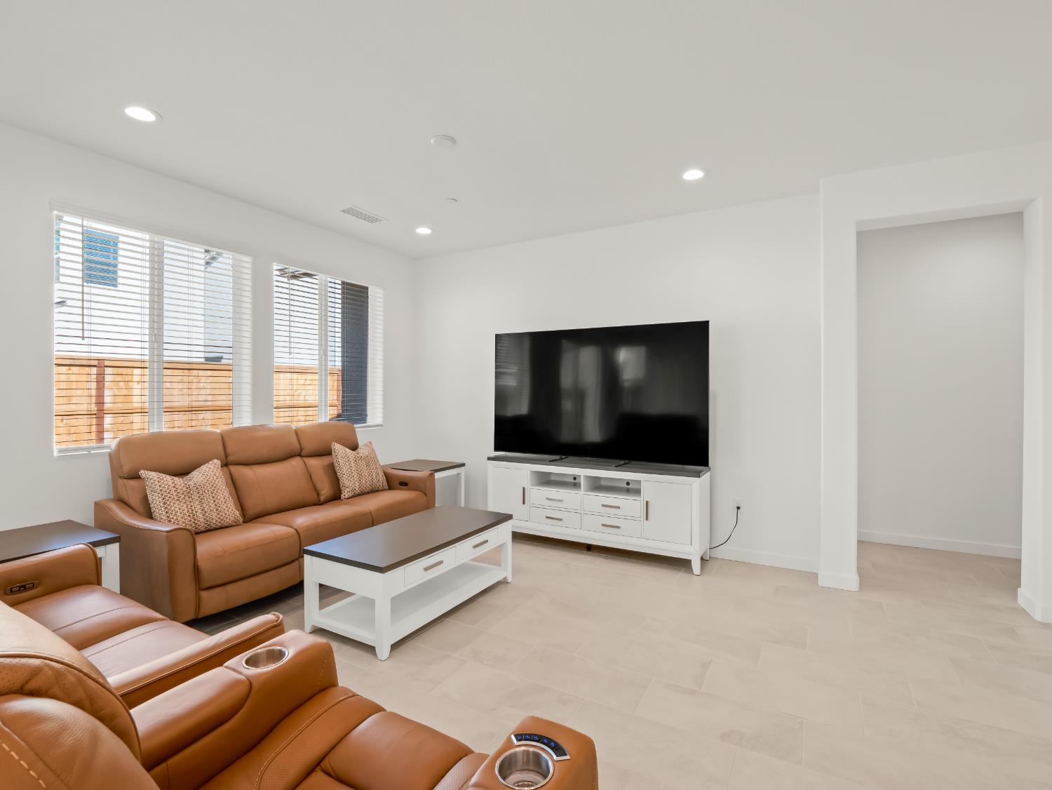 781 Elizabeth Avenue Madera, CA 93636 - Photo 22 of 31 a living room with furniture and a flat screen tv