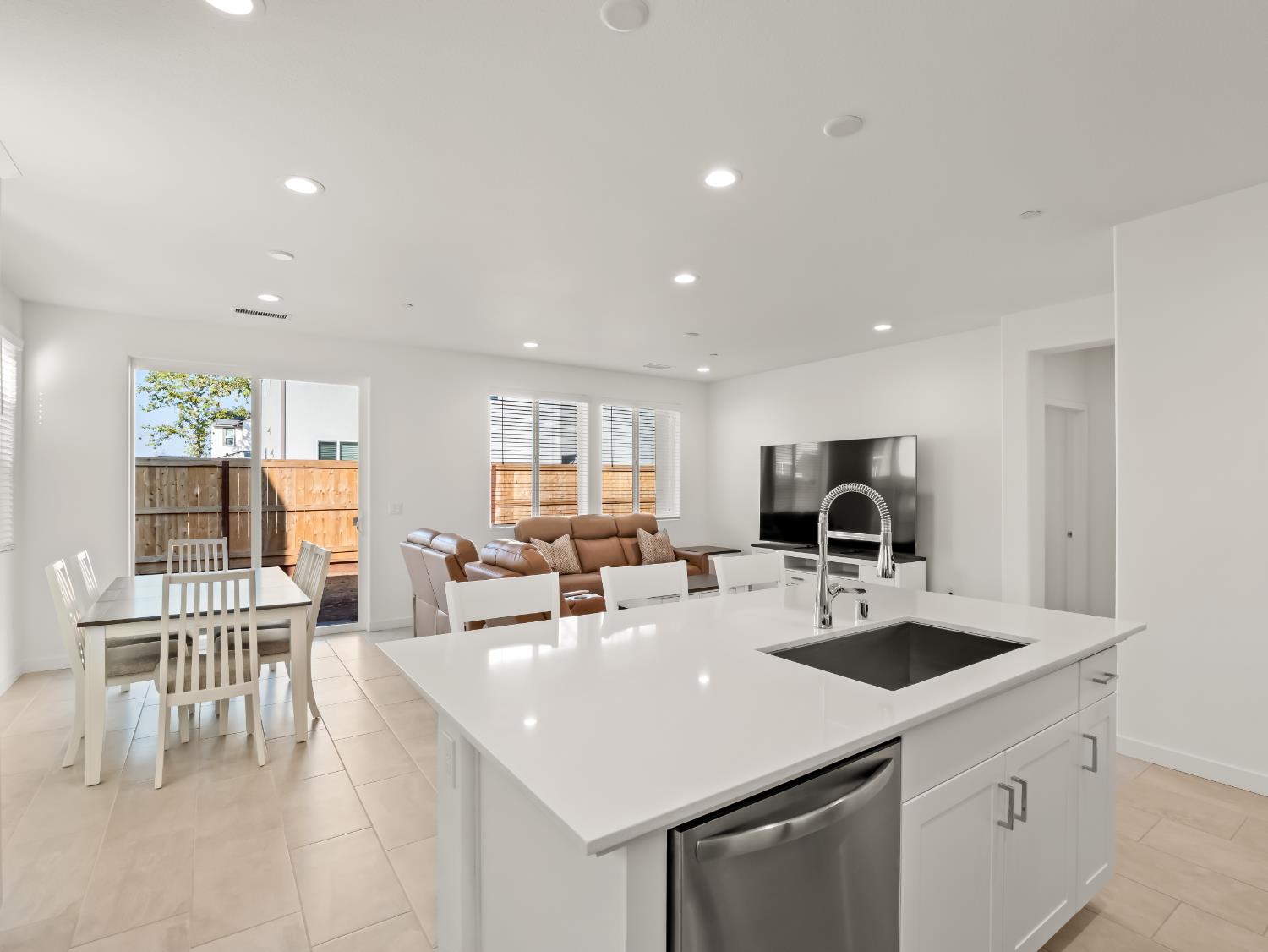 781 Elizabeth Avenue Madera, CA 93636 - Photo 4 of 31 a kitchen with a sink a table and chairs