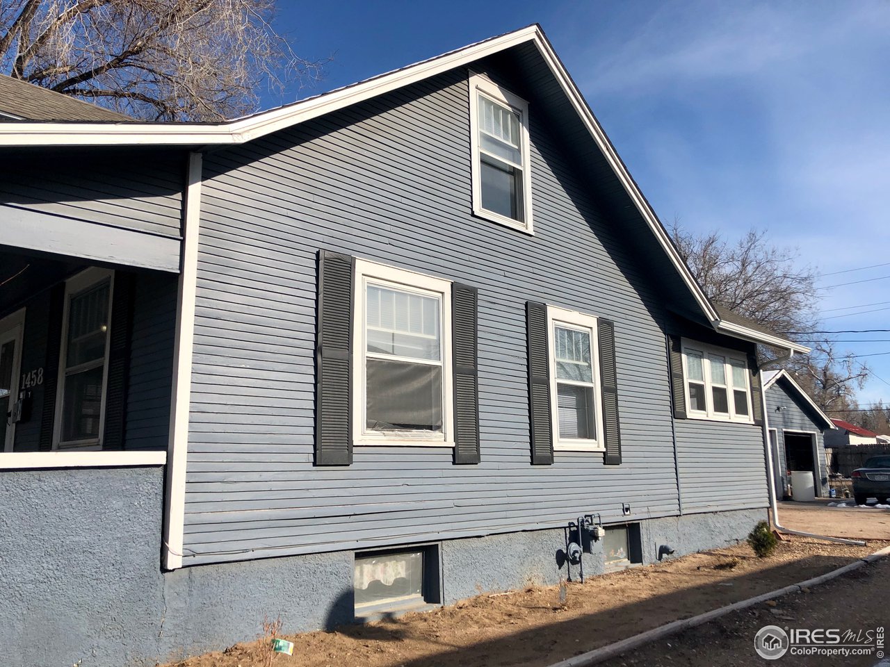 1458 10th Street Greeley, CO 80631 - Photo 17 of 21 a front view of a house with balcony