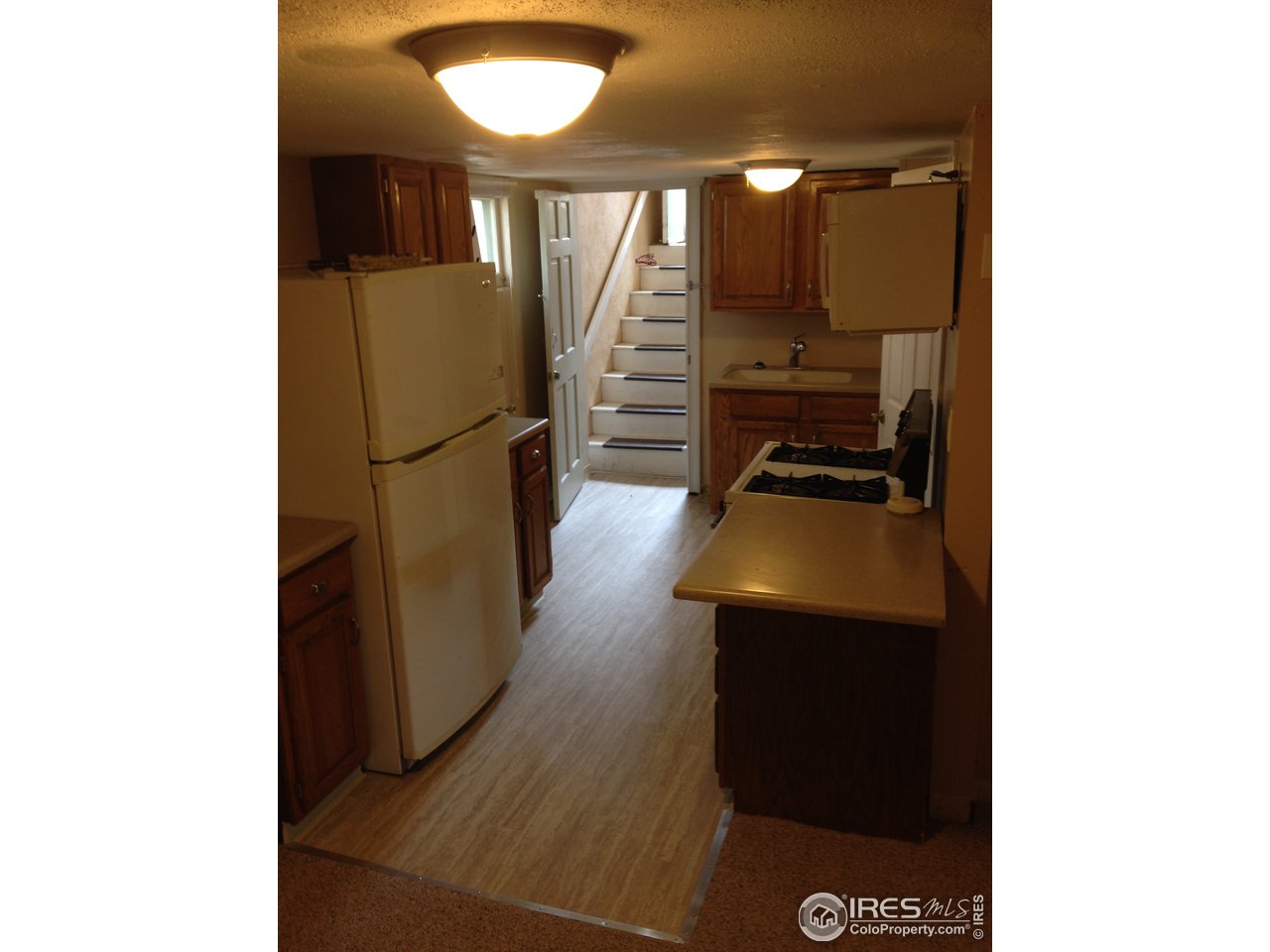 1458 10th Street Greeley, CO 80631 - Photo 19 of 21 a view of a hallway with workspace