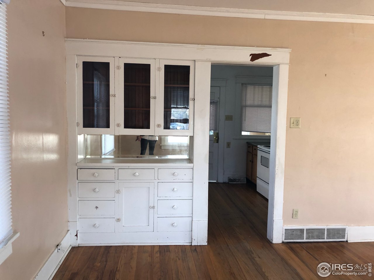 1458 10th Street Greeley, CO 80631 - Photo 2 of 21 a bathroom with a sink and a mirror