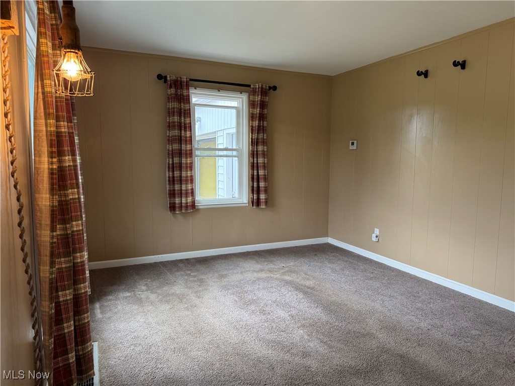 1139 Kessel Avenue Akron, OH 44310 - Photo 22 of 36 Empty room with carpet flooring and baseboards