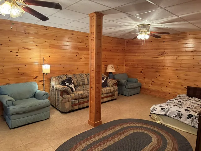 a living room with furniture and a rug