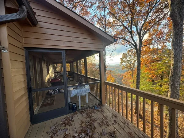 a balcony view with a seating space