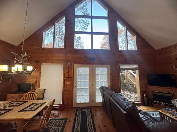 a living room with furniture fireplace and flat screen tv