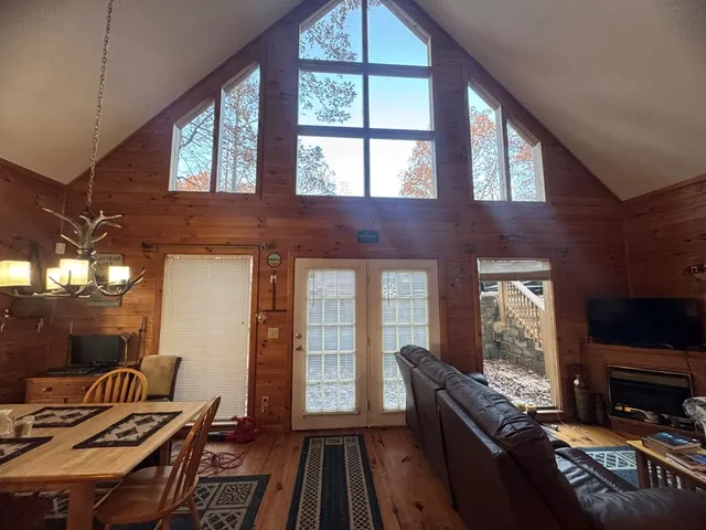 a living room with furniture fireplace and flat screen tv