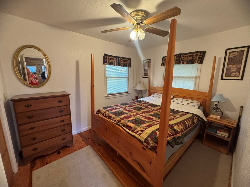 664 Fox Run Drive Blue Ridge, GA 30513 - Photo 9 of 19 a bed sitting in a bedroom next to a window