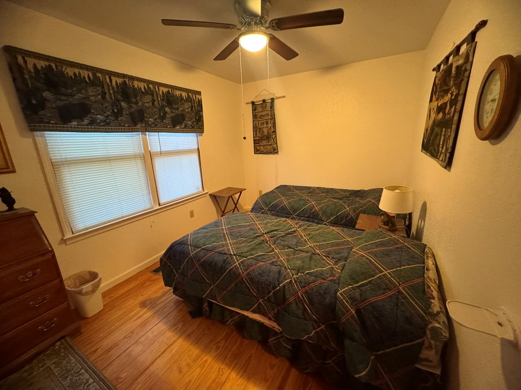 664 Fox Run Drive Blue Ridge, GA 30513 - Photo 10 of 19 a bedroom with a bed and a mirror