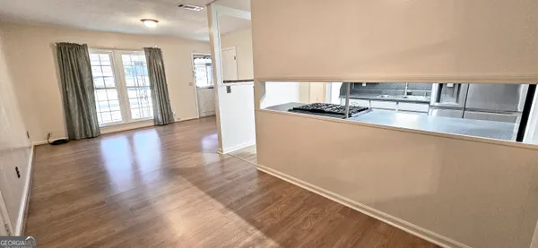 a kitchen with stainless steel appliances a refrigerator and a stove