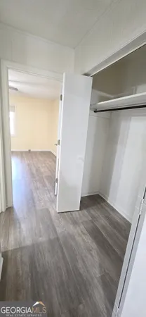 a bathroom with a sink toilet and mirror