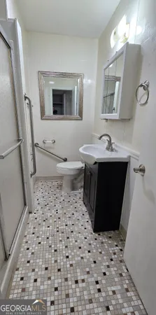 a bathroom with a sink and a shower