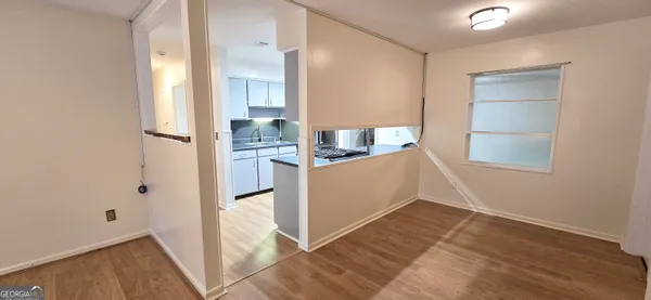 a view of kitchen with wooden floor