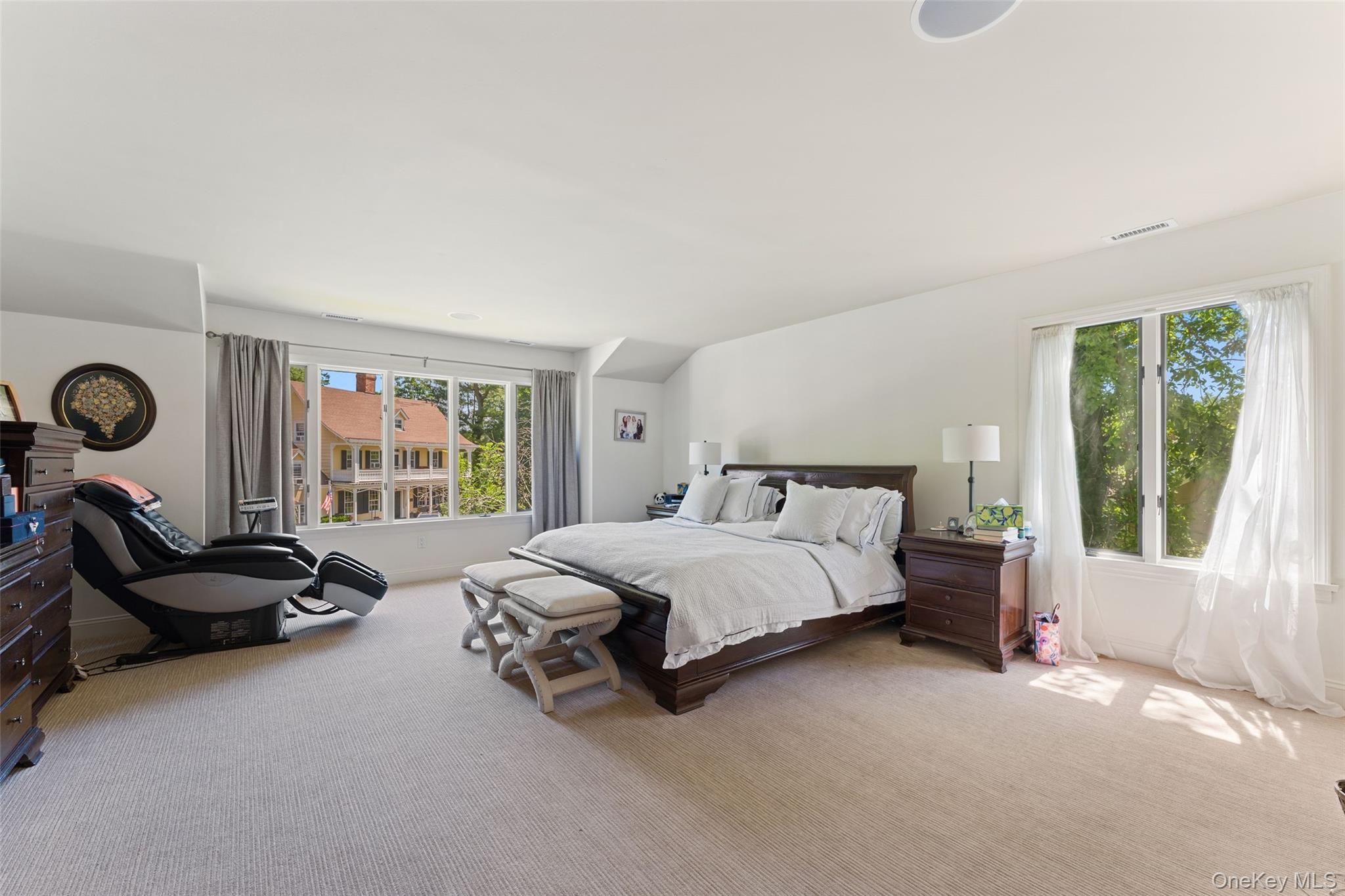 6 Magnetti Circle Mamaroneck, NY 10543 - Photo 12 of 24 a spacious bedroom with a bed and a large window