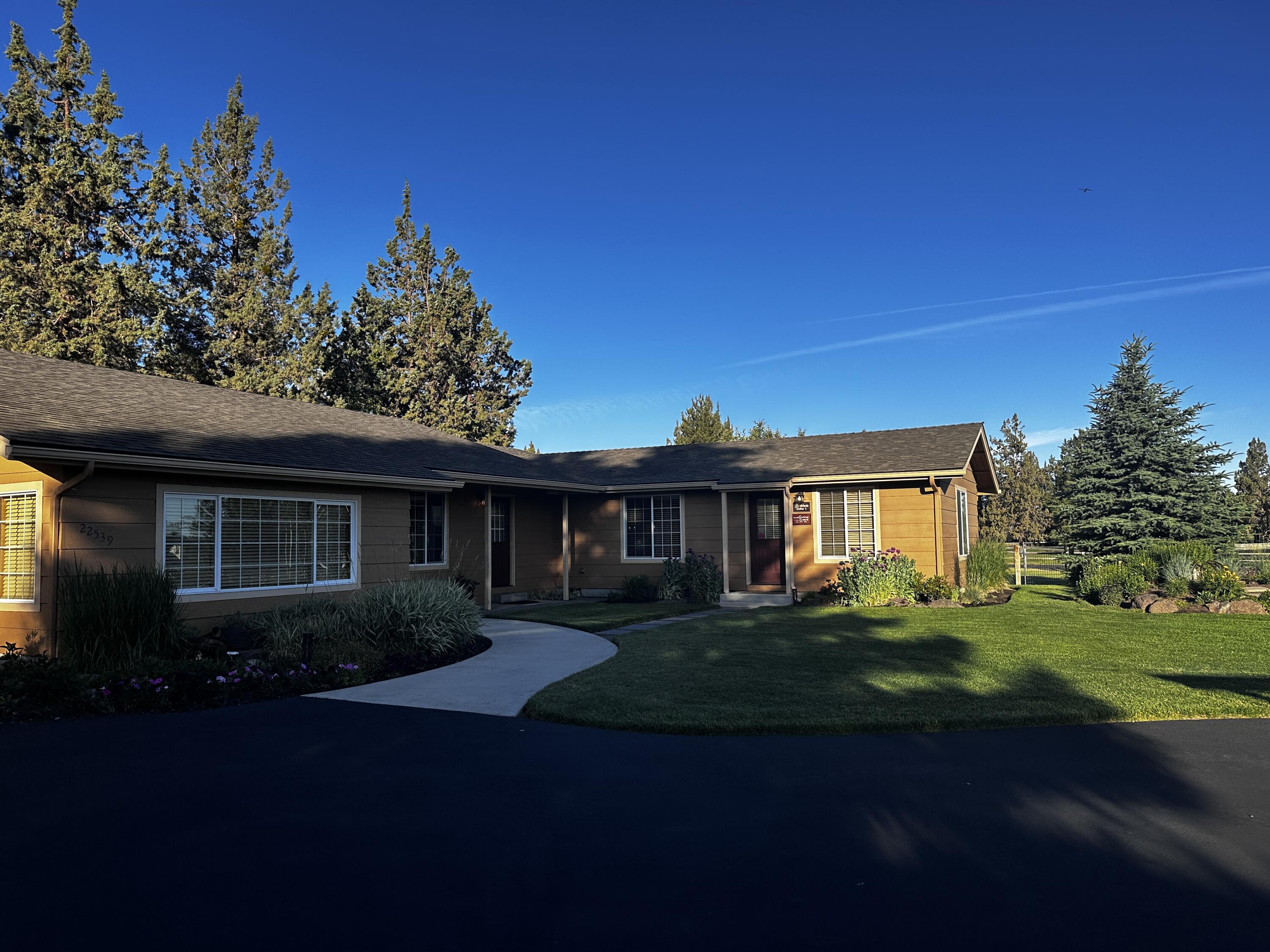 22539 Martee Lane Bend, OR 97701 - Photo 50 of 54 a front view of a house with a garden