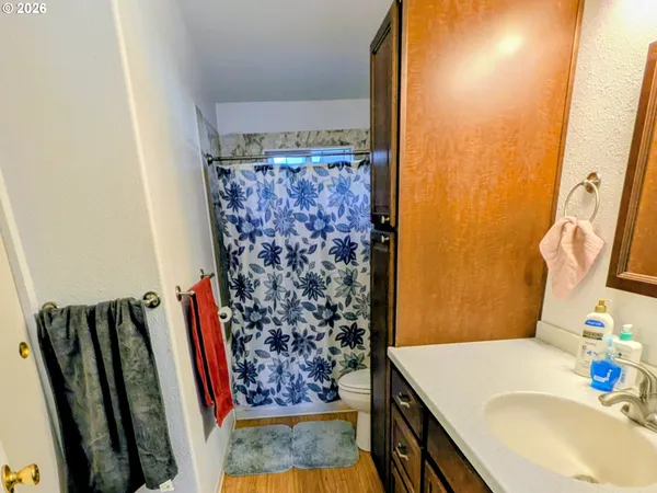 a bathroom with a bathtub and shower