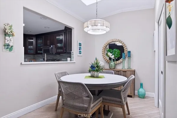 a view of a dining room with furniture wooden floor and chandelier
