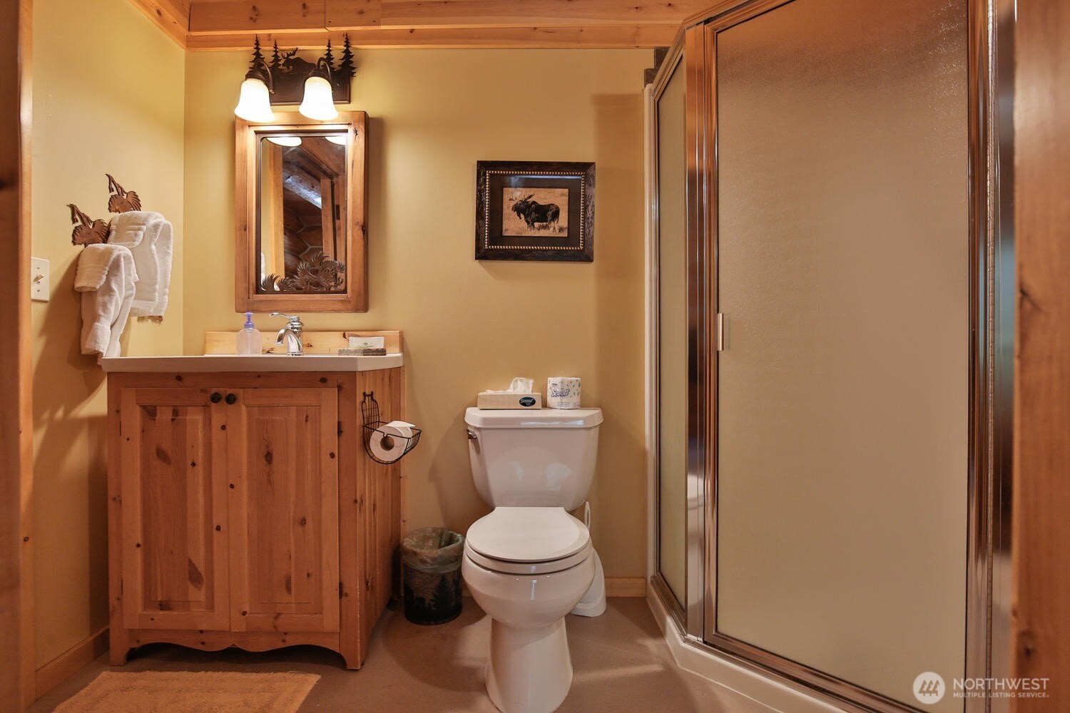 18135 River Road Leavenworth, WA 98826 - Photo 12 of 39 a bathroom with a toilet a sink and mirror
