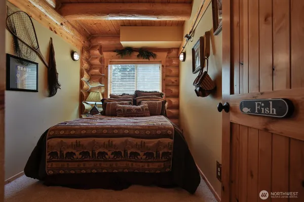 a bedroom with bed and window