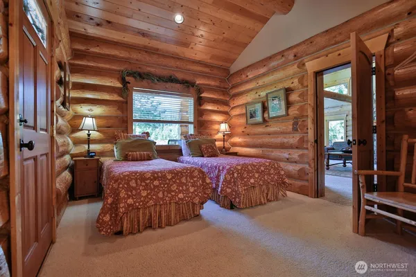 a bedroom with furniture and a window