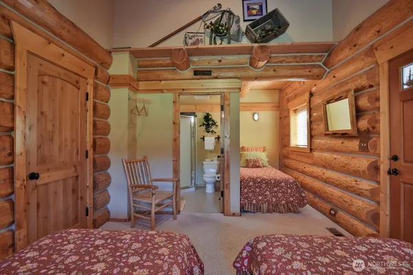 a bedroom with a bed and a table