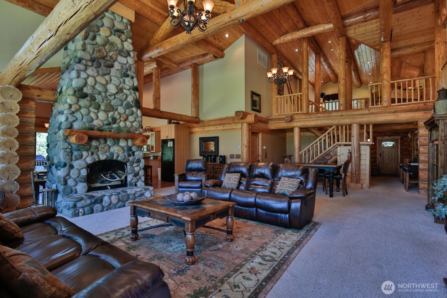 18135 River Road Leavenworth, WA 98826 - Photo 19 of 39 a living room with furniture and a fireplace