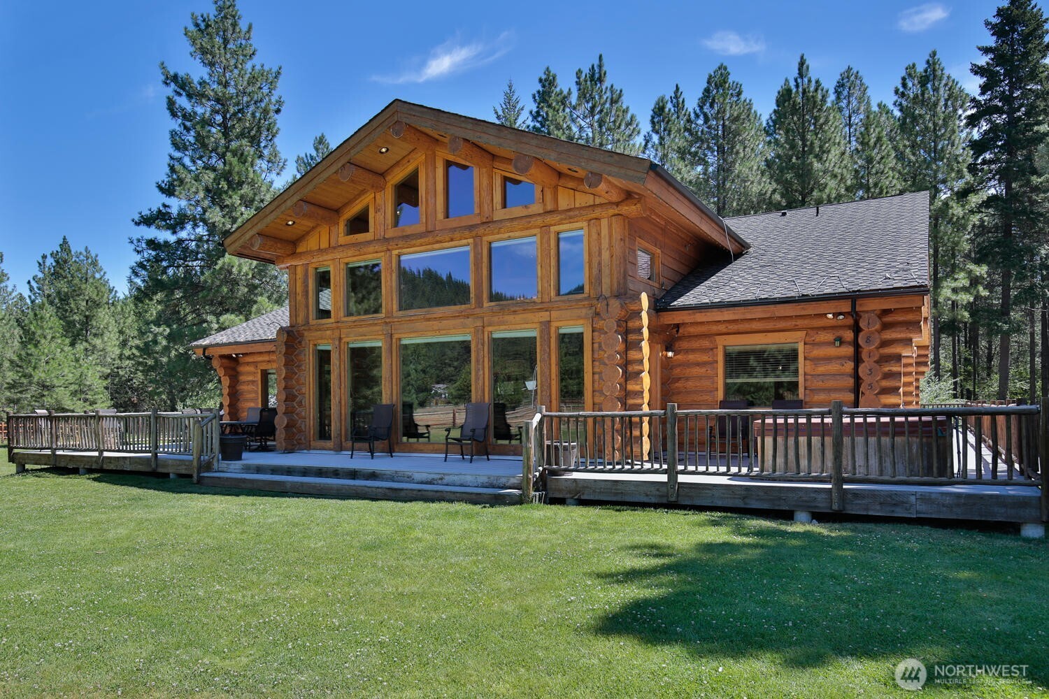 18135 River Road Leavenworth, WA 98826 - Photo 2 of 39 a front view of a house with a garden and porch