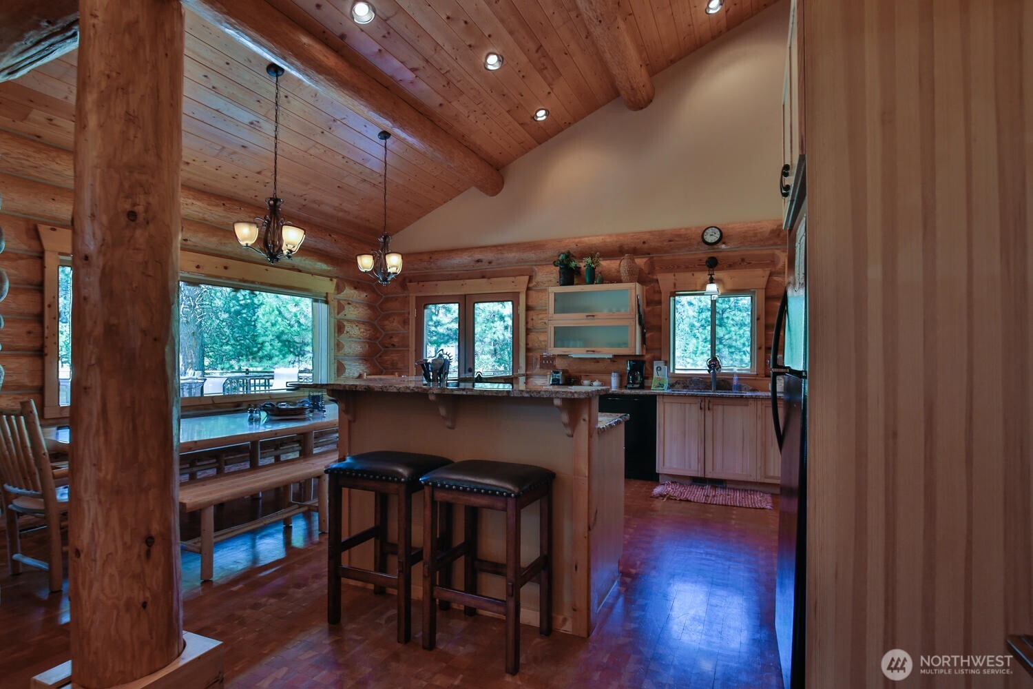 18135 River Road Leavenworth, WA 98826 - Photo 25 of 39 a dining room with furniture and wooden floor