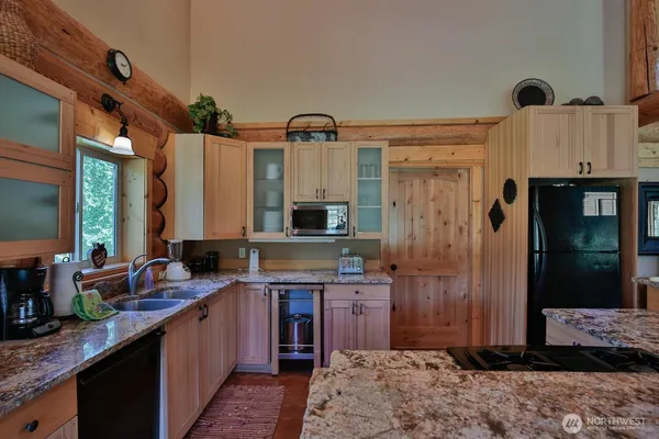 a kitchen with a sink stove and refrigerator