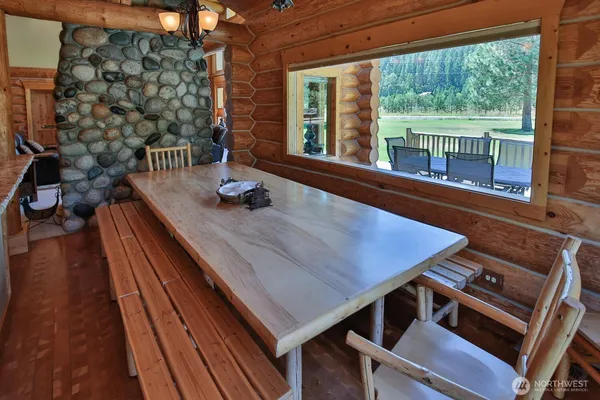 a view of a patio with table and chairs