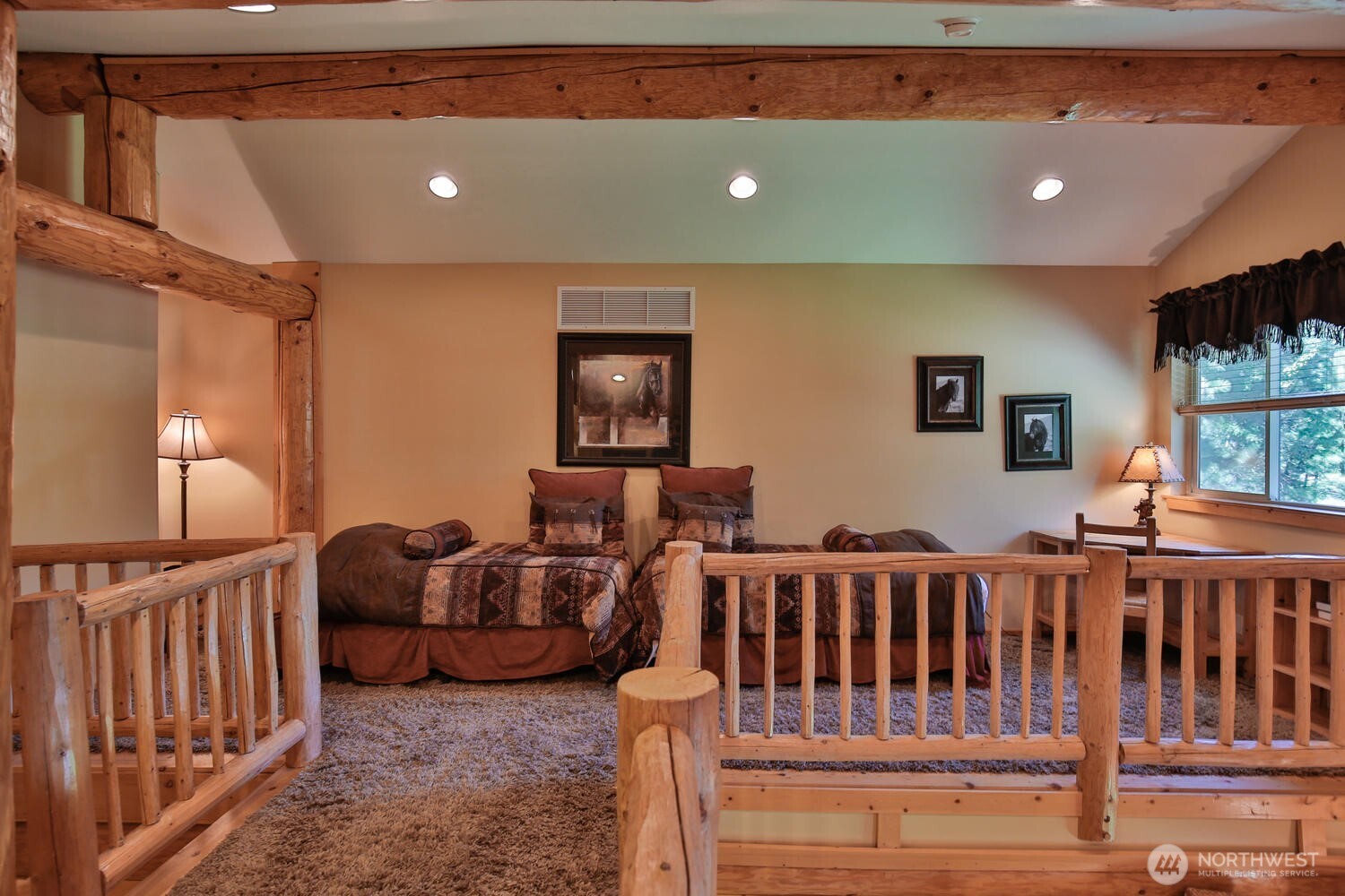 18135 River Road Leavenworth, WA 98826 - Photo 36 of 39 a living room with furniture stairs and a flat screen tv