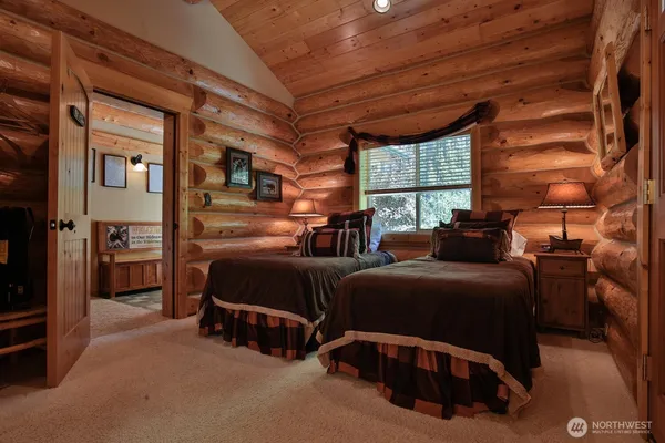 a bedroom with furniture and a window