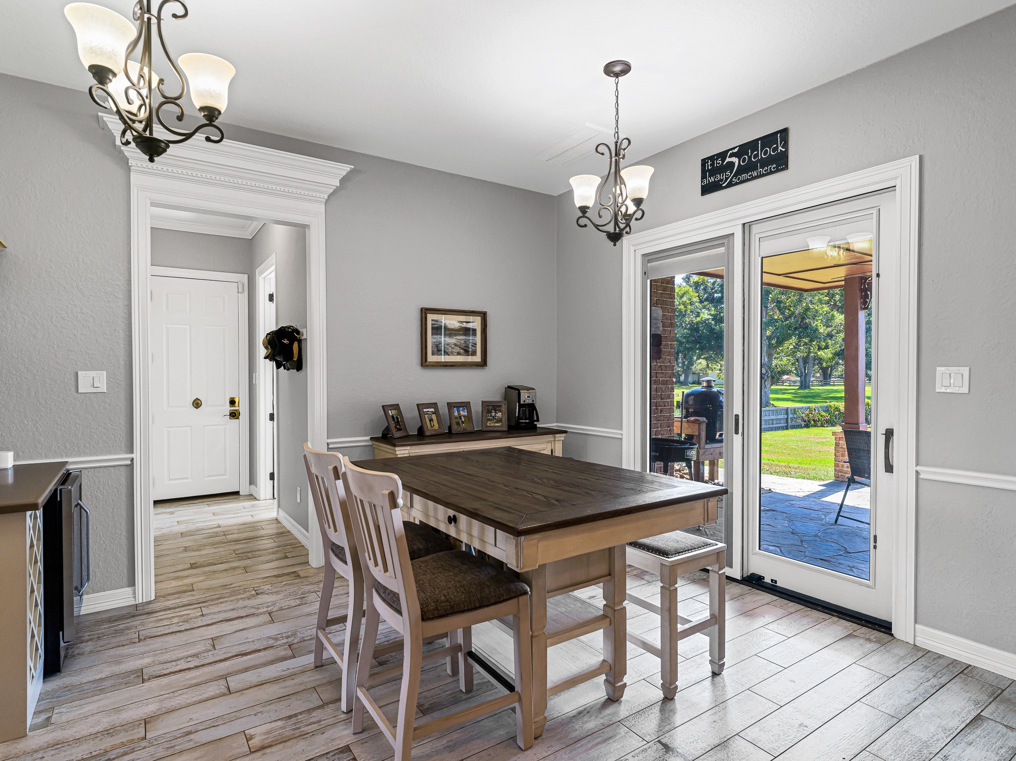 100 Pecan Grove Road Sealy, TX 77474 - Photo 20 of 48 a dining room with wooden floor a chandelier a wooden table and chairs