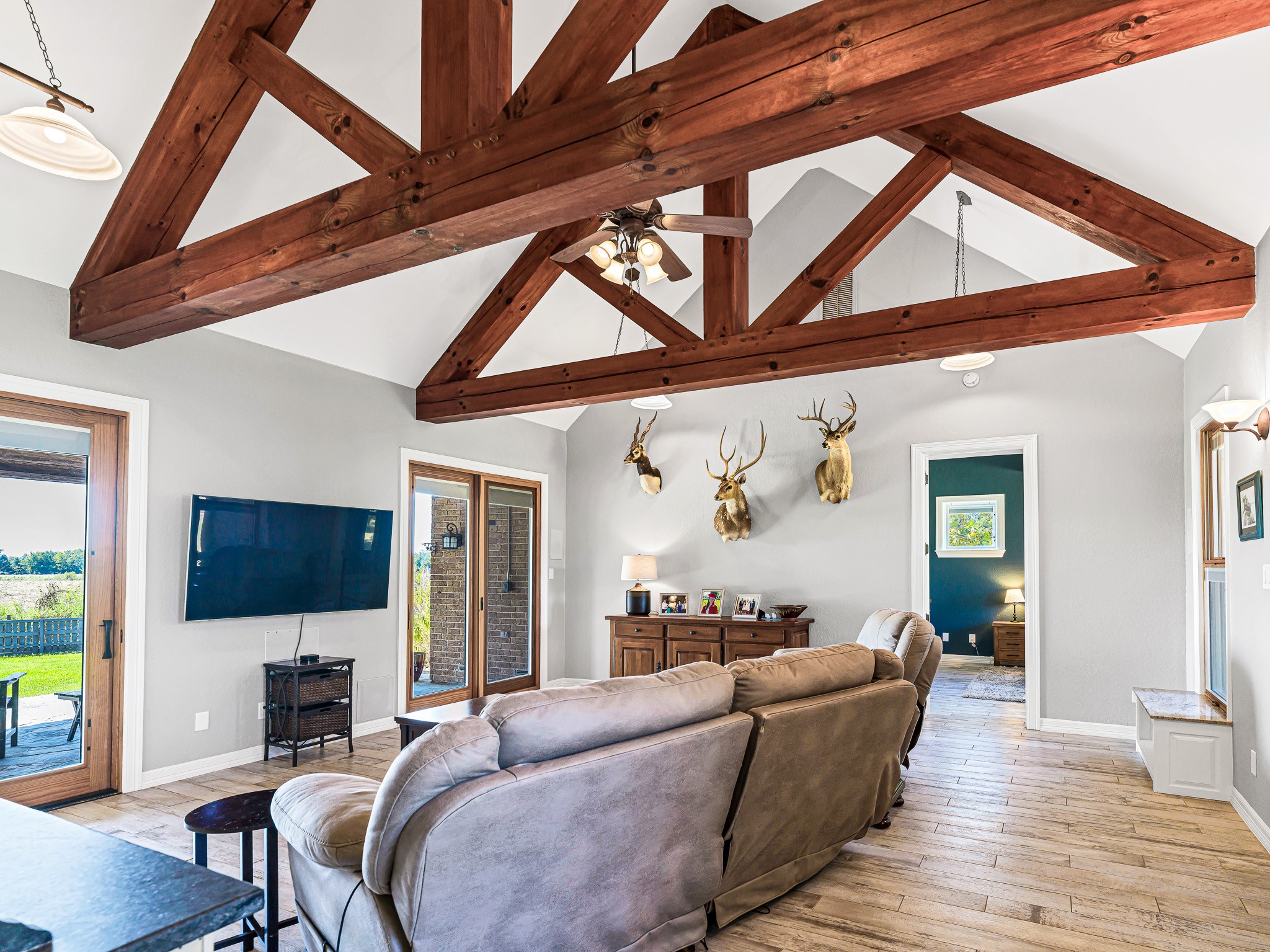 100 Pecan Grove Road Sealy, TX 77474 - Photo 8 of 48 a living room with furniture a fireplace and a flat screen tv