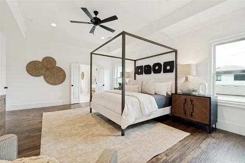 a bedroom with a bed and window