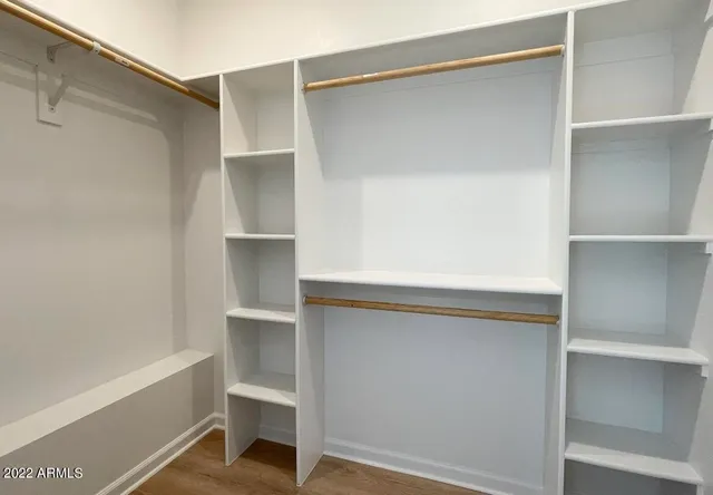 a view of an empty walk in closet