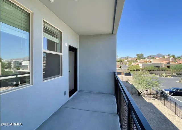 a bathroom with a double vanity sink mirror and toilet