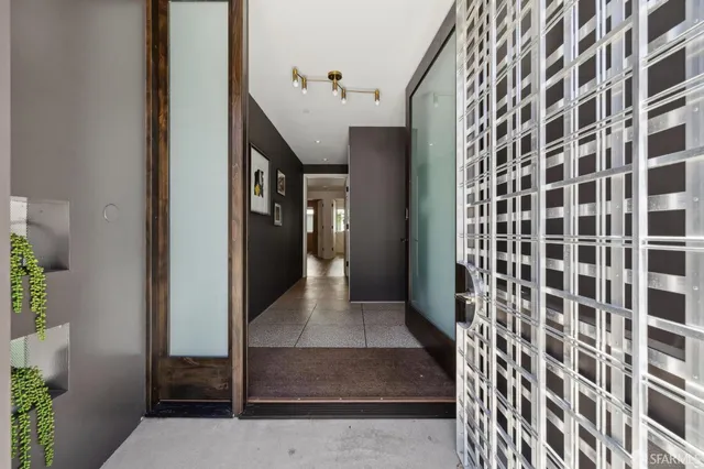 a bed room with a bed and a television