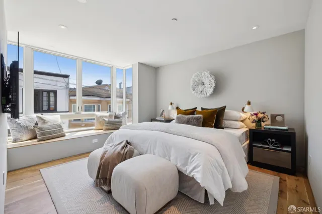 a bedroom with a bed and a table in it