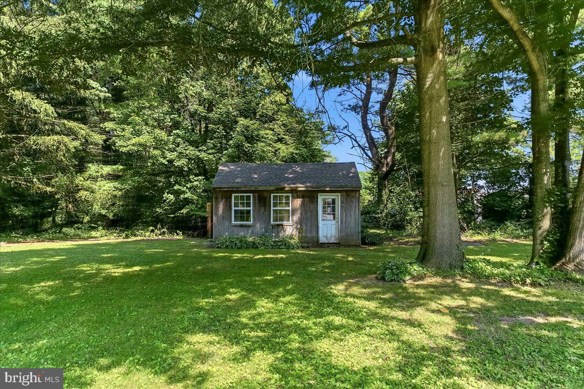 2765 Blue Ball Road Elkton, MD 21921 - Photo 47 of 54 Charming cabin nestled in lush greenery.