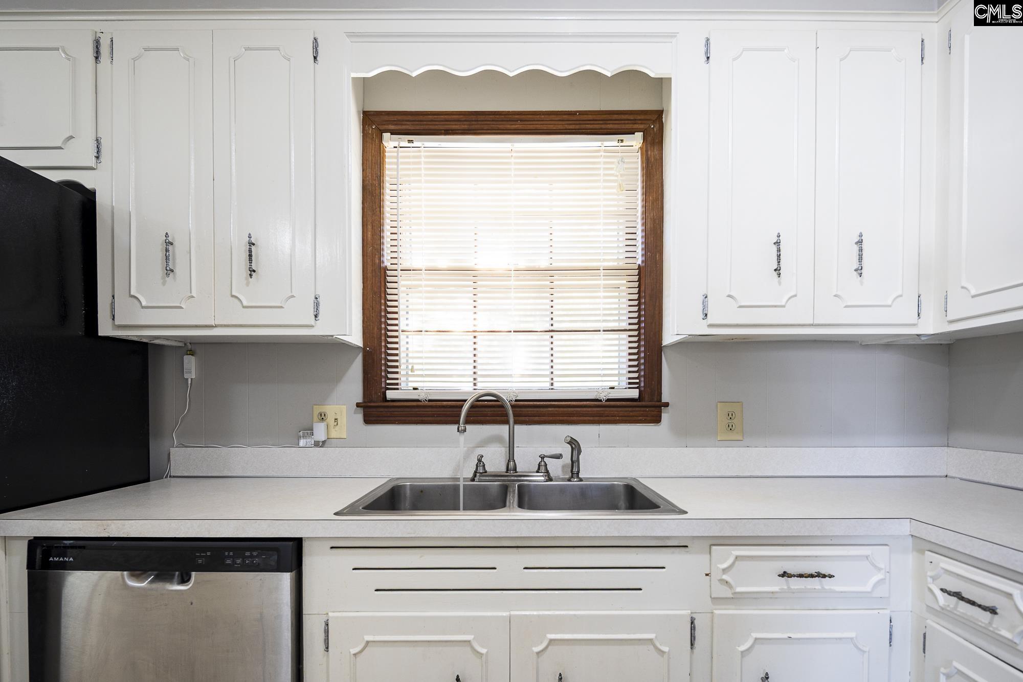 4083 Platt Springs Road West Columbia, SC 29170 - Photo 11 of 35 a kitchen with appliances cabinets and a sink