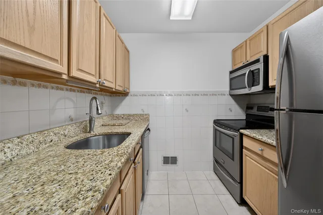 $335,000 | 54 School Street, Unit 205, Westbury, NY 11590