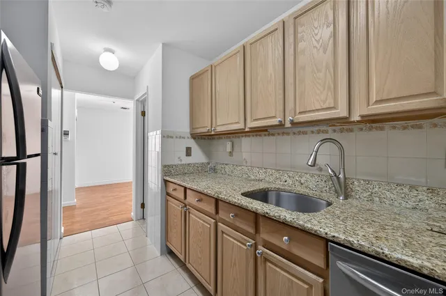 $335,000 | 54 School Street, Unit 205, Westbury, NY 11590