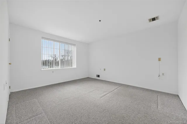 $335,000 | 54 School Street, Unit 205, Westbury, NY 11590