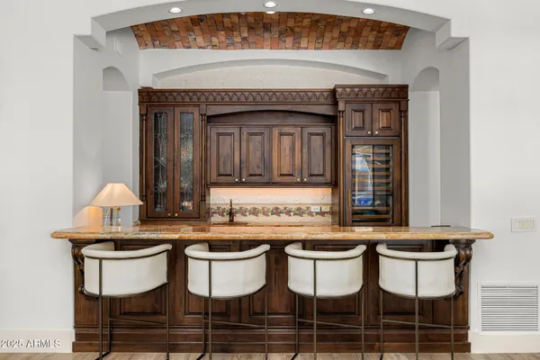 a kitchen with a sink and a refrigerator