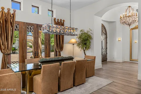 a view of a living room and entryway with furniture